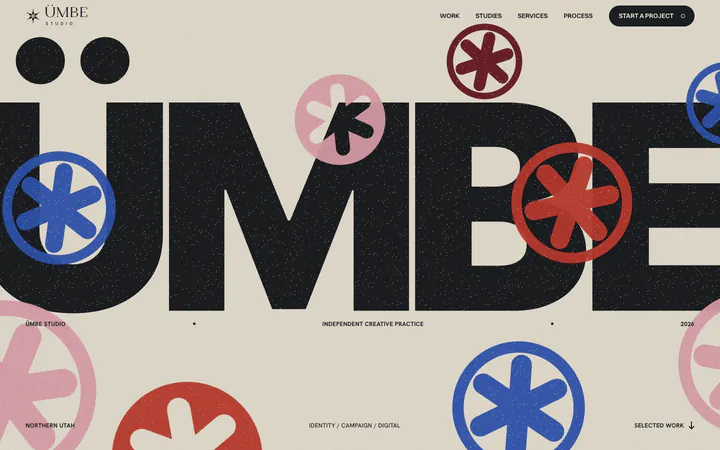 The first poster draft: a giant clean ÜMBE in capitals with nine ring stickers spread evenly across it and a dark pill button in the navigation.